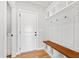 Mudroom with bench and hooks for hanging items at 55 Firefly Ln, Louisburg, NC 27549
