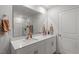 Bathroom featuring double sinks, a large mirror, and a tiled shower at 628 Dorado Rd, Wendell, NC 27591