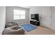 Carpeted bonus room with two beanbag chairs, a flat-screen TV, and a window at 628 Dorado Rd, Wendell, NC 27591