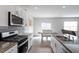 Modern kitchen with granite counters, stainless appliances and easy access to dining area at 628 Dorado Rd, Wendell, NC 27591