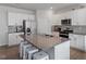 Bright kitchen with granite countertops, stainless steel appliances, and a large island at 628 Dorado Rd, Wendell, NC 27591