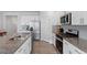 Updated kitchen with stainless steel appliances and granite countertops at 628 Dorado Rd, Wendell, NC 27591