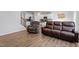 Open-concept living area with hardwood floors and a view into the modern kitchen at 628 Dorado Rd, Wendell, NC 27591