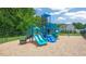 Community playground area surrounded by trees and mulch at 628 Dorado Rd, Wendell, NC 27591