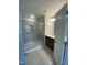 Modern bathroom with a glass-enclosed shower, dark wood vanity, and neutral tile flooring at 9212 Leaning Post Rd # 448, Wake Forest, NC 27587