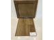 Features a wood cabinet door and Shaw luxury vinyl plank flooring in 7089 Wild Dunes color at 9212 Leaning Post Rd # 448, Wake Forest, NC 27587