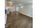 Spacious living room featuring wood floors, recessed lighting, and abundant natural light at 9212 Leaning Post Rd # 448, Wake Forest, NC 27587