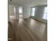 Inviting living room with lots of natural light and warm wood floors at 9212 Leaning Post Rd # 448, Wake Forest, NC 27587