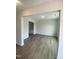 Bright living room with light gray walls and wood flooring, perfect for entertaining at 9212 Leaning Post Rd # 448, Wake Forest, NC 27587