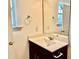 A cozy bathroom features a window, single vanity, and an oversized mirror at 140 Token House Rd, Durham, NC 27703
