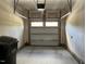 Attached garage offering ample space and a garage door with window inserts at 140 Token House Rd, Durham, NC 27703
