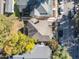 An aerial view of a well-maintained house with a deck and mature landscaping, in a neighborhood setting at 215 E Cabarrus St, Raleigh, NC 27601