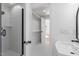 Bright bathroom features a walk-in shower and modern vanity at 215 E Cabarrus St, Raleigh, NC 27601