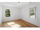 This is a bright bedroom with hardwood floors and lots of natural light at 215 E Cabarrus St, Raleigh, NC 27601