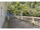 Wooden deck overlooks the backyard and is surrounded by mature trees at 215 E Cabarrus St, Raleigh, NC 27601