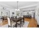 Open-concept dining area with views of the modern kitchen and stainless steel appliances at 215 E Cabarrus St, Raleigh, NC 27601
