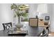 Dining room table setting with a vase, glassware, and a lamp at 215 E Cabarrus St, Raleigh, NC 27601