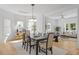 Well-lit dining room with hardwood floors connects to a cozy living space at 215 E Cabarrus St, Raleigh, NC 27601