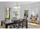 Dining area with windows offering natural light and a view of the backyard at 215 E Cabarrus St, Raleigh, NC 27601