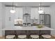 Bright kitchen with a large island, white cabinets, and stainless steel appliances at 215 E Cabarrus St, Raleigh, NC 27601