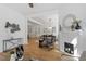 Open layout living room with fireplace leading to dining area at 215 E Cabarrus St, Raleigh, NC 27601