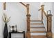 Beautiful staircase with wooden handrail, white risers and decorative newel posts at 215 E Cabarrus St, Raleigh, NC 27601