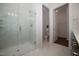 Modern bathroom featuring marble floors and shower with glass door and dual shower heads at 239 Harvester Rd, Angier, NC 27501