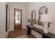 Modern entryway with a decorative glass door, console table, and hardwood floors at 239 Harvester Rd, Angier, NC 27501