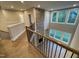 Bright foyer showcasing hardwood floors, a stone accent wall, and a staircase at 274 Golden Leaf Farms Rd, Angier, NC 27501