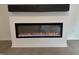 Modern fireplace with a sleek, built-in design and an electric flame effect at 3317 Oakfields Rd # 5, New Hill, NC 27562