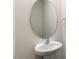 Powder room with pedestal sink, oval mirror, and neutral wall paint at 236 Moore Creek Dr, Fuquay Varina, NC 27526