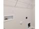 Inside laundry room with shelving and hookups at 236 Moore Creek Dr, Fuquay Varina, NC 27526