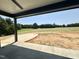Open backyard with expansive views, well manicured lawn and extended patio at 280 Forest Bridge Rd, Franklinton, NC 27525