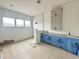 Bathroom with modern tile shower, grey vanity, and bright natural light at 280 Forest Bridge Rd, Franklinton, NC 27525