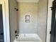 Clean bathroom features bathtub with tile backsplash and dark hardware at 280 Forest Bridge Rd, Franklinton, NC 27525