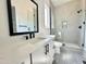 Modern bathroom featuring a white vanity with black fixtures and a glass-enclosed shower with patterned tile at 280 Forest Bridge Rd, Franklinton, NC 27525