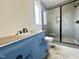 Bathroom featuring modern shower with dark fixtures and tiled walls and a modern vanity at 280 Forest Bridge Rd, Franklinton, NC 27525