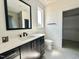 Modern bathroom with a sleek vanity, black fixtures, a framed mirror, and an elegant tile backsplash and flooring at 280 Forest Bridge Rd, Franklinton, NC 27525
