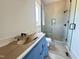 Modern bathroom features a glass-enclosed shower and contemporary fixtures at 280 Forest Bridge Rd, Franklinton, NC 27525
