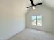 Bright bedroom with a vaulted ceiling, ceiling fan, and a large window overlooking the neighborhood at 280 Forest Bridge Rd, Franklinton, NC 27525