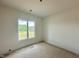 Bright bedroom with single window overlooking a grassy area and trees at 280 Forest Bridge Rd, Franklinton, NC 27525