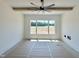 Well-lit bedroom featuring a neutral color scheme, ceiling fan, large window, and hardwood flooring at 280 Forest Bridge Rd, Franklinton, NC 27525