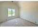 A bedroom with a large window provides natural light, highlighting the room's potential at 280 Forest Bridge Rd, Franklinton, NC 27525