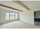 Bedroom with beautiful wooden ceiling beams and large windows at 280 Forest Bridge Rd, Franklinton, NC 27525