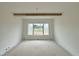 White bedroom with a large window overlooking greenery at 280 Forest Bridge Rd, Franklinton, NC 27525