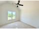 Well-lit bedroom with a ceiling fan and a large window to see the outdoors at 280 Forest Bridge Rd, Franklinton, NC 27525