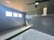 Modern bedroom with sleek dark walls, stylish wall trim, and ample natural light at 280 Forest Bridge Rd, Franklinton, NC 27525