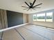 Bedroom features a ceiling fan, a large window, and a contemporary wall design at 280 Forest Bridge Rd, Franklinton, NC 27525