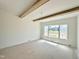 Bright bedroom with large windows, wood beams, and a view of the outdoors at 280 Forest Bridge Rd, Franklinton, NC 27525