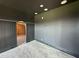 Dark bedroom showcasing stylish wall trim and an ensuite bathroom at 280 Forest Bridge Rd, Franklinton, NC 27525